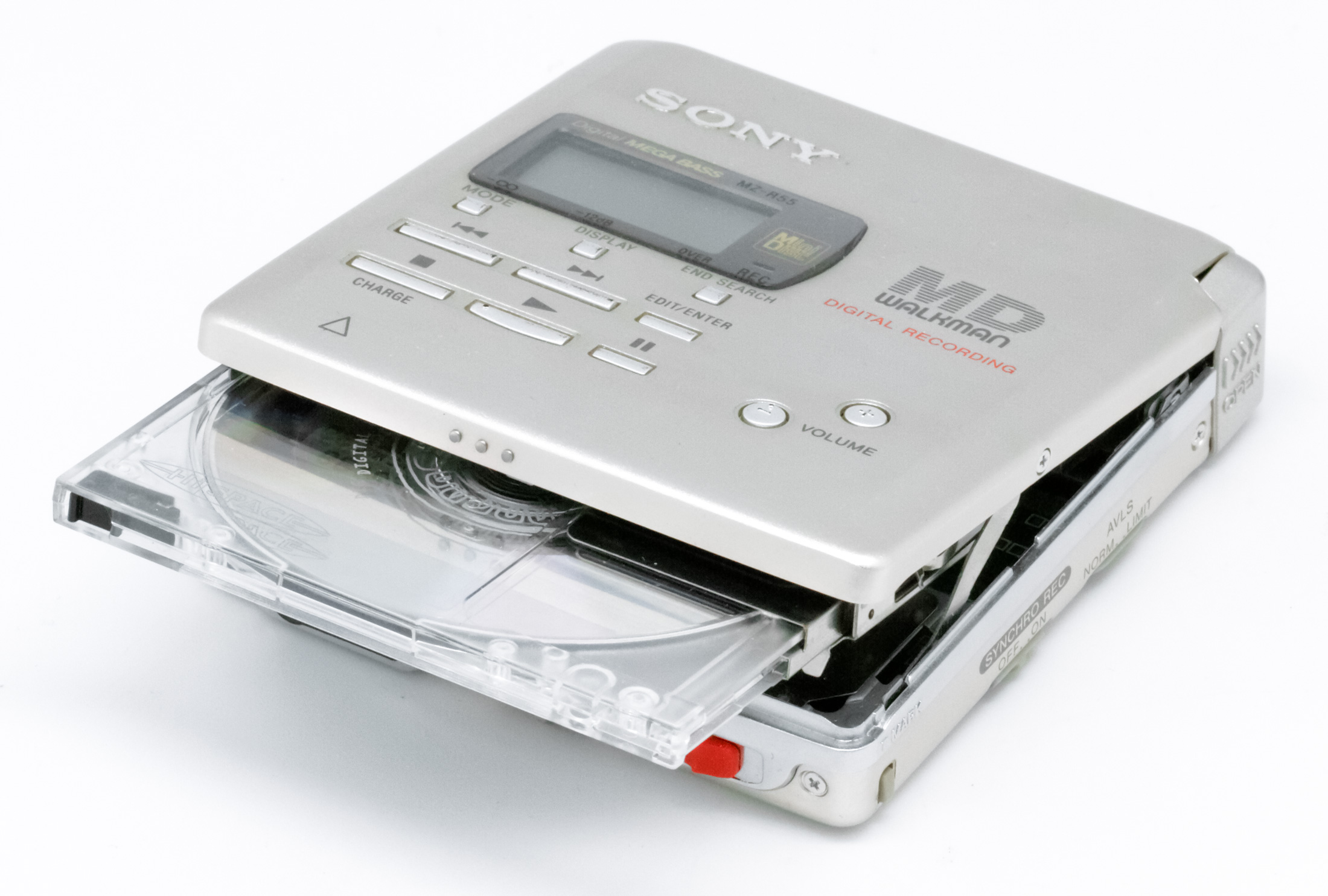 Side-on up-close photograph of the MiniDisc player. Light silver casing, it is open, with a transparent see through MiniDisc just put halfway inside.