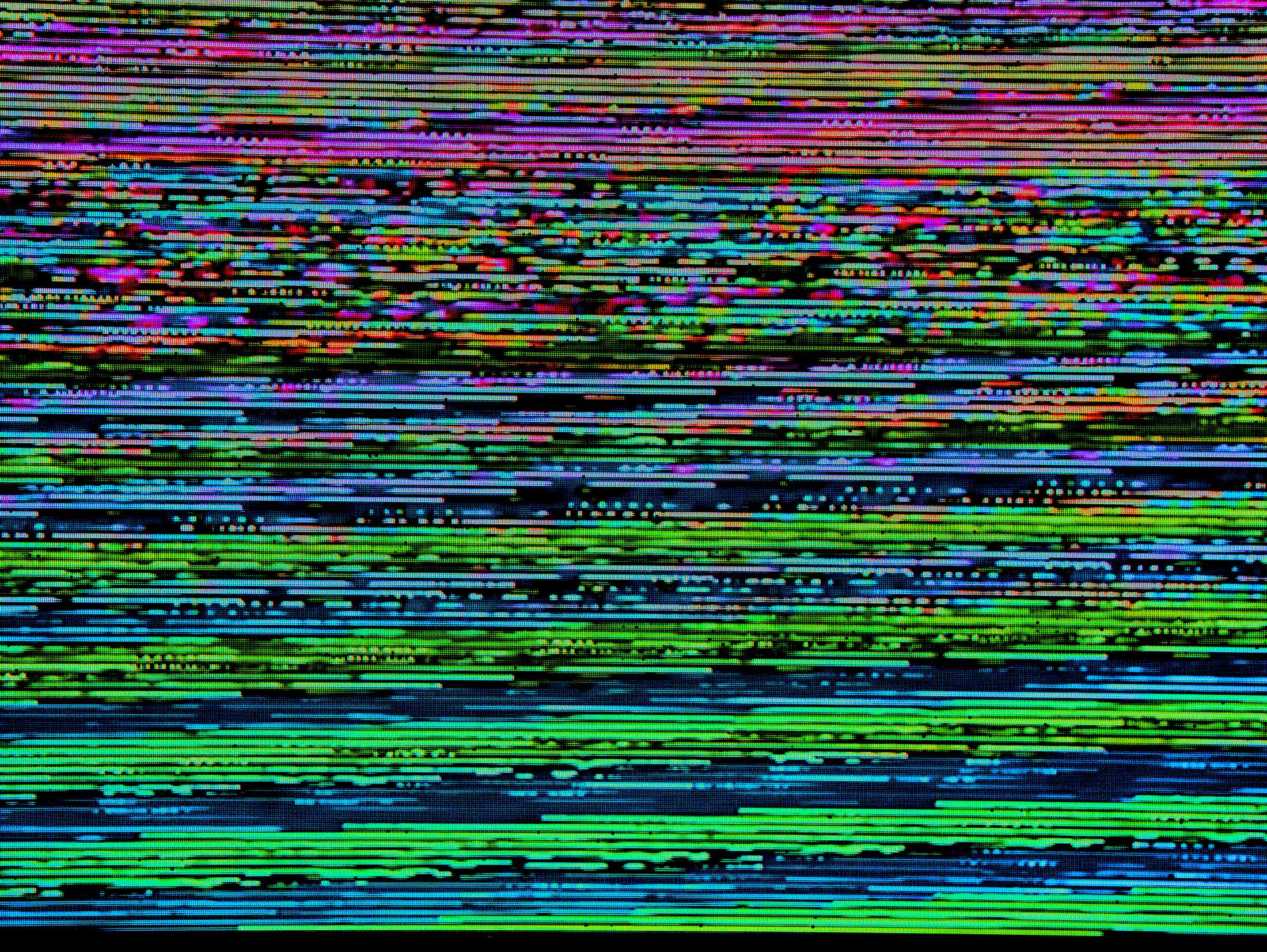 Error glitch screen, show loads of pixel dots in green and red lines across the screen horizontally.